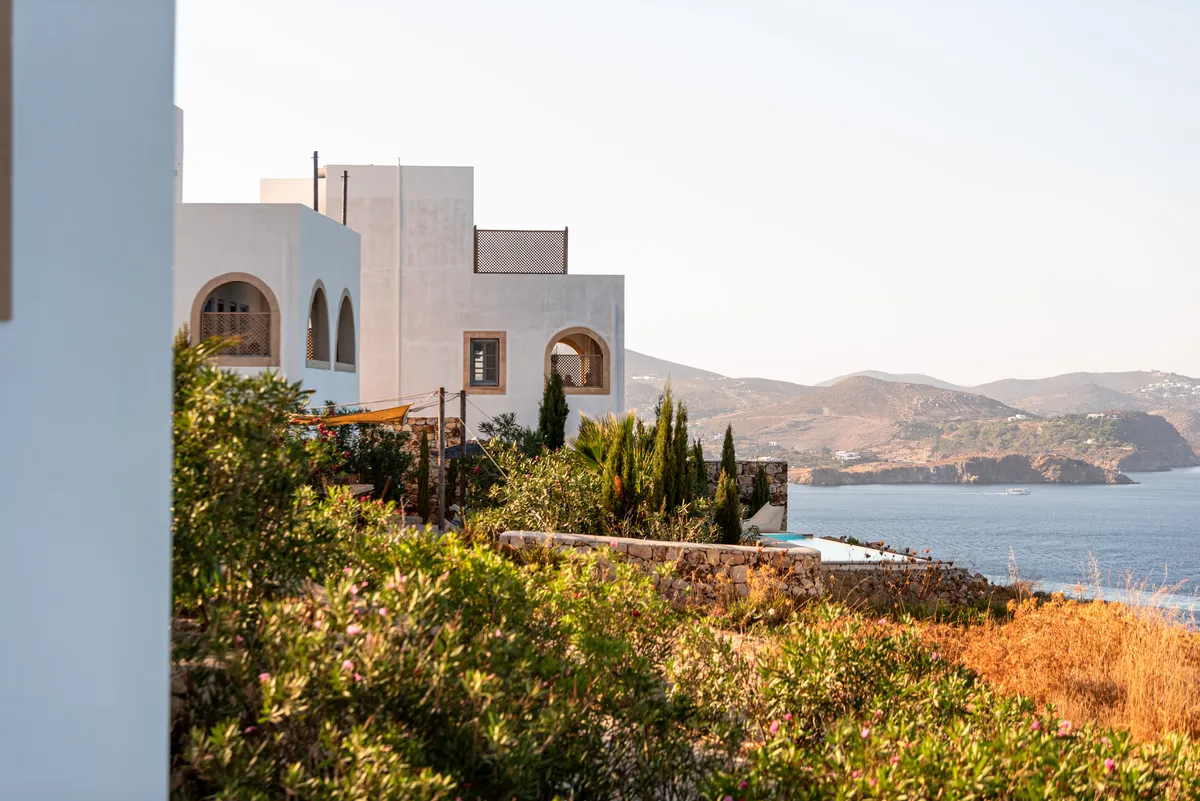 White houses on a hillside above the sea