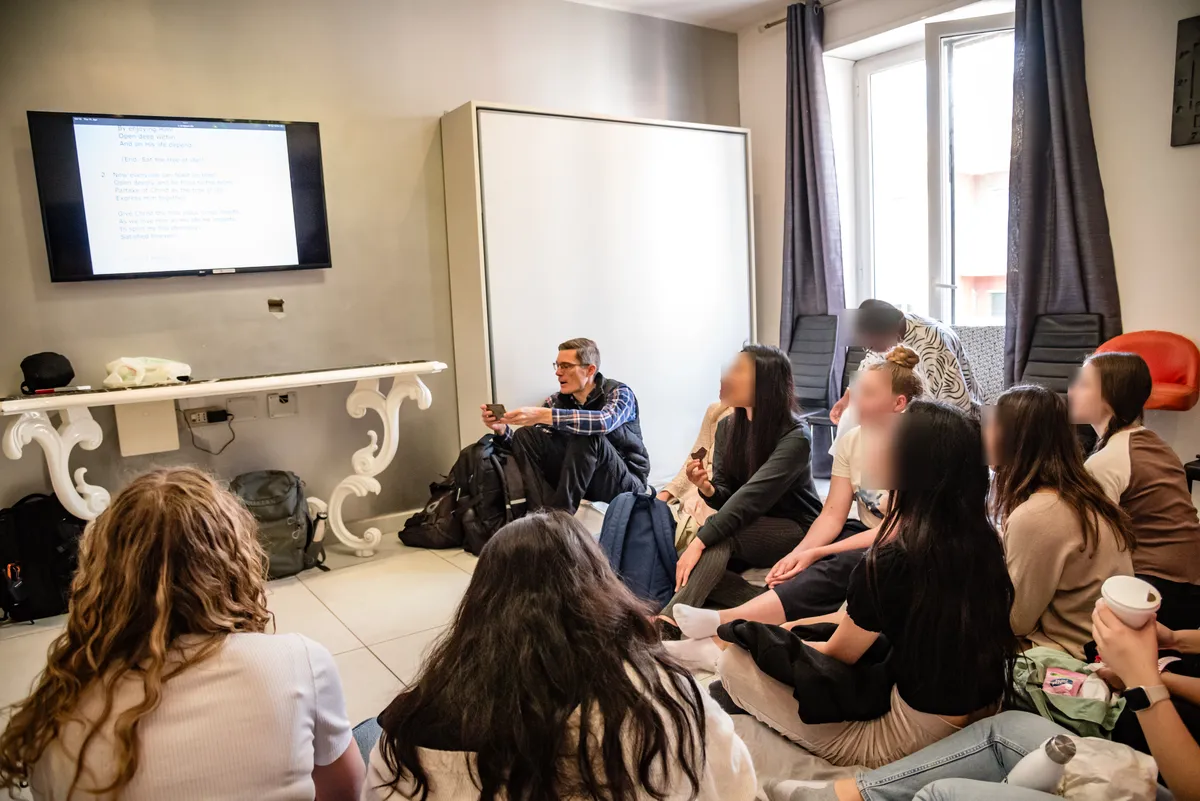 Students sitting together for a talk in a shared flat
