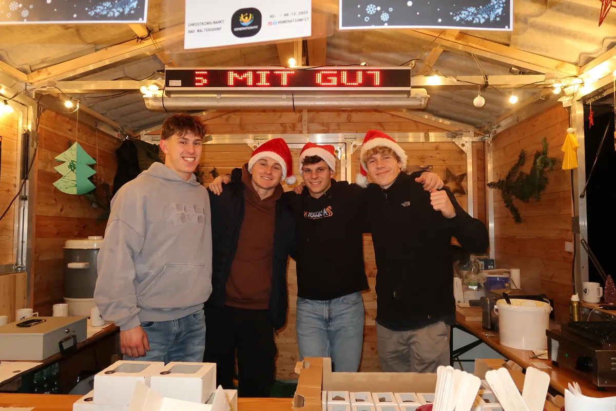 Students at a Vienna Christmas market hut